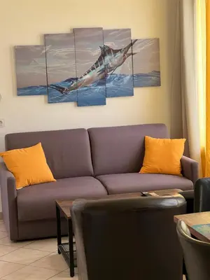 Coin salon dans l'établissement Residence Appartement le Porto