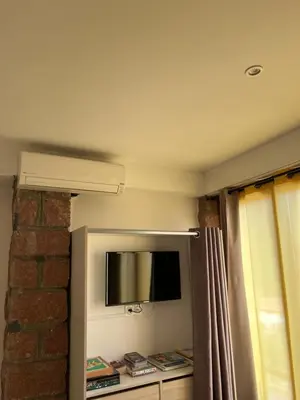 Télévision ou salle de divertissement dans l'établissement Residence Appartement le Porto