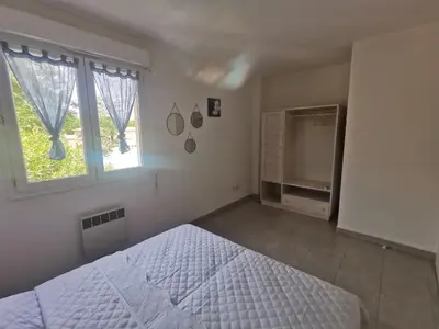 Un ou plusieurs lits dans un hébergement de l'établissement Villa Melody duplex climatisée piscine