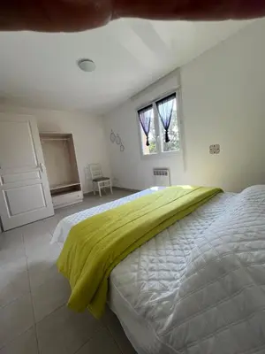 Un ou plusieurs lits dans un hébergement de l'établissement Villa Melody duplex climatisée piscine