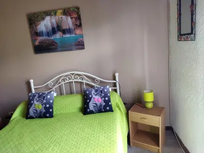 Un ou plusieurs lits dans un hébergement de l'établissement Agréable villa 100 m de la plage