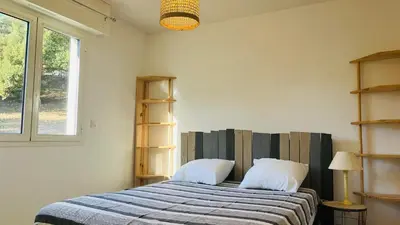 Un ou plusieurs lits dans un hébergement de l'établissement Appartement Le Domaine L'ILE ROUSSE