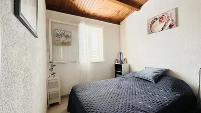Un ou plusieurs lits dans un hébergement de l'établissement Appartement T3 Boug 15 LUMIO