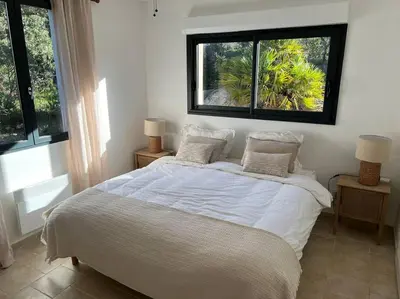 Un ou plusieurs lits dans un hébergement de l'établissement Maison Jardin d'Agrumes - Lozari