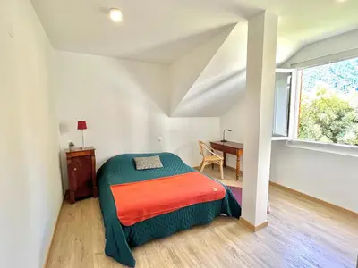 Un ou plusieurs lits dans un hébergement de l'établissement Appartement rez de villa CORTE