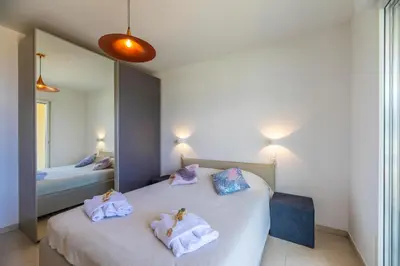 Un ou plusieurs lits dans un hébergement de l'établissement Residence A Marina