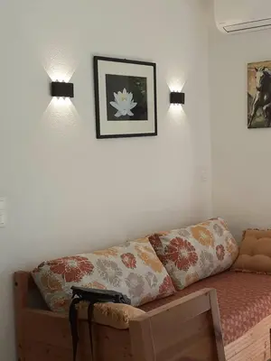 Coin salon dans l'établissement Bel appartement avec piscine- Poggio Mezzana