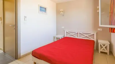 Un ou plusieurs lits dans un hébergement de l'établissement Mini-villa alliance wifi proche ile rousse