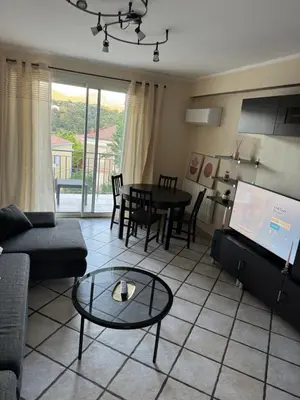 Coin salon dans l'établissement Appartement T4