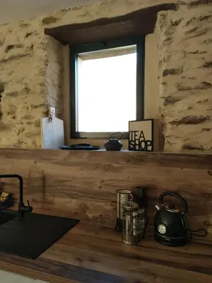 Cuisine ou kitchenette dans l'établissement U MULINU