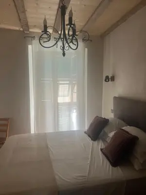 Un ou plusieurs lits dans un hébergement de l'établissement Appartement prestige, cour Paoli