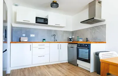 Cuisine ou kitchenette dans l'établissement Casamea - T3 U Benestà