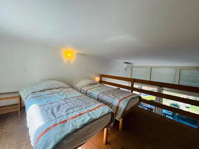 Un ou plusieurs lits dans un hébergement de l'établissement Appartement Libeccio 41 LUMIO