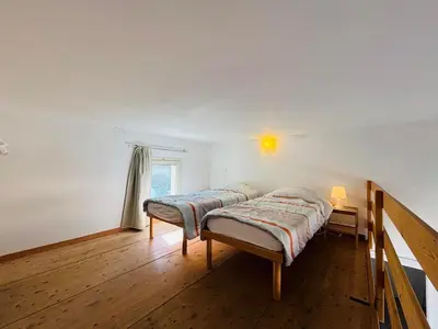 Un ou plusieurs lits dans un hébergement de l'établissement Appartement Libeccio 42 LUMIO