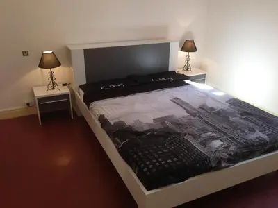 Un ou plusieurs lits dans un hébergement de l'établissement Appartement Kalliste