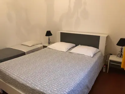 Un ou plusieurs lits dans un hébergement de l'établissement Appartement Kalliste