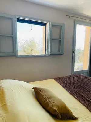 Un ou plusieurs lits dans un hébergement de l'établissement Maison Murato