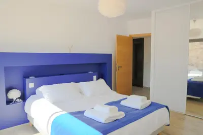 Un ou plusieurs lits dans un hébergement de l'établissement Villa Mare Monti 3 chambres