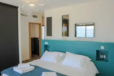 Un ou plusieurs lits dans un hébergement de l'établissement Villa Mare Monti 2 chambres