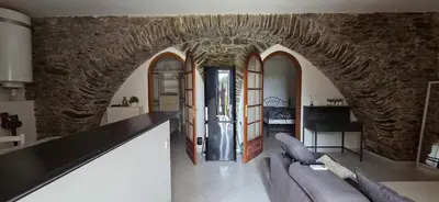 Coin salon dans l'établissement Charmante Maison de village, Proche Aéroport