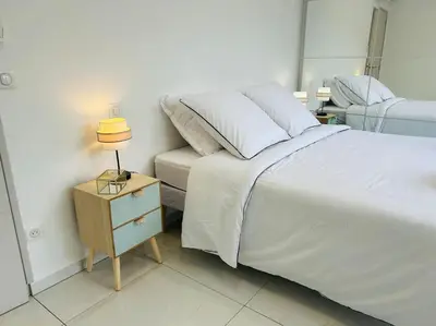 Un ou plusieurs lits dans un hébergement de l'établissement Villa Climatisée avec Piscine partagée , Terrasse et Parking