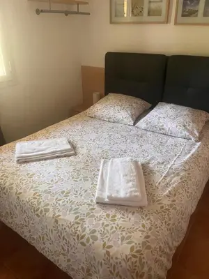 Un ou plusieurs lits dans un hébergement de l'établissement appartement bord de mer en Corse avec 2 piscines 100 metres de la plage