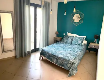 Un ou plusieurs lits dans un hébergement de l'établissement Bel Appartement en plein cœur de Folelli