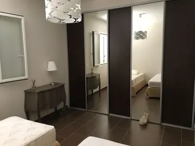 Un ou plusieurs lits dans un hébergement de l'établissement Maison à Saint-Florent avec piscine privée