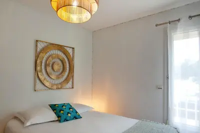 Un ou plusieurs lits dans un hébergement de l'établissement Appartement 