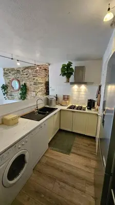 Cuisine ou kitchenette dans l'établissement Maison de famille