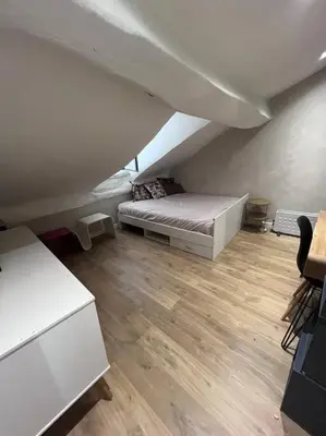 Un ou plusieurs lits dans un hébergement de l'établissement Appartement centre ville.