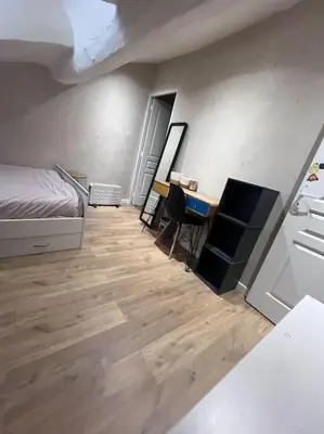 Un ou plusieurs lits dans un hébergement de l'établissement Appartement centre ville.