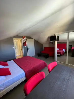 Un ou plusieurs lits dans un hébergement de l'établissement Chambres hôtes chez Fernand