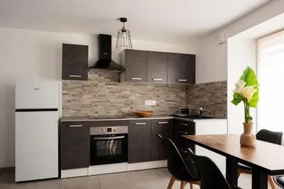 Cuisine ou kitchenette dans l'établissement Appartement départ GR20