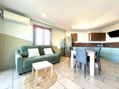 Coin salon dans l'établissement Appartement ALERIA 2/4 personnes