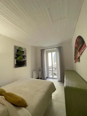 Un ou plusieurs lits dans un hébergement de l'établissement Appartement en plein Centre