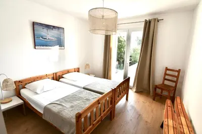 Un ou plusieurs lits dans un hébergement de l'établissement Appartement 60m2 avec piscine privée dans villa
