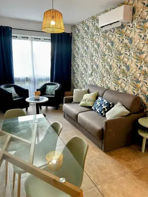 Coin salon dans l'établissement Entre montagne et mer