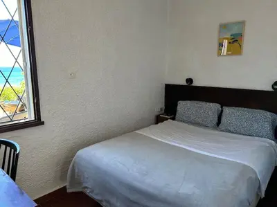 Un ou plusieurs lits dans un hébergement de l'établissement Maison les pieds dans l'eau