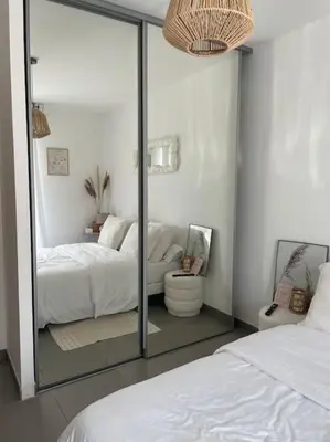 Un ou plusieurs lits dans un hébergement de l'établissement Appartement T2 avec jardin