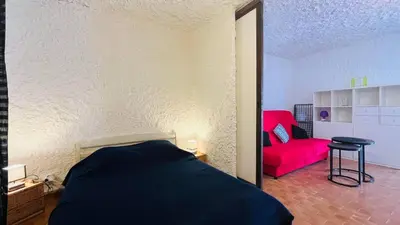 Un ou plusieurs lits dans un hébergement de l'établissement Studio Cocody 84 LUMIO