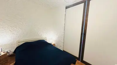 Un ou plusieurs lits dans un hébergement de l'établissement Studio Cocody 84 LUMIO
