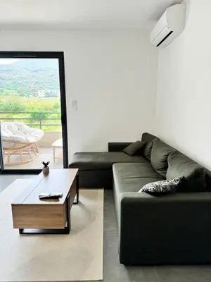Coin salon dans l'établissement Logement calme et agréable