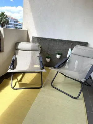 Coin salon dans l'établissement MORIANI Plage T2 terrasse proche mer et commerces