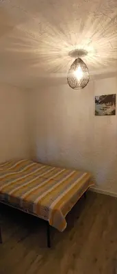 Un ou plusieurs lits dans un hébergement de l'établissement Petite maison en Balagne, belle vue mer