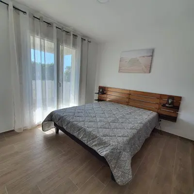 Un ou plusieurs lits dans un hébergement de l'établissement appartement Oliviaaxelle