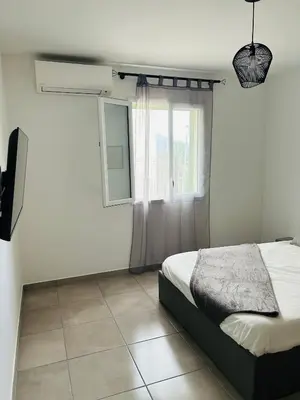 Un ou plusieurs lits dans un hébergement de l'établissement Appartement T2 Corte