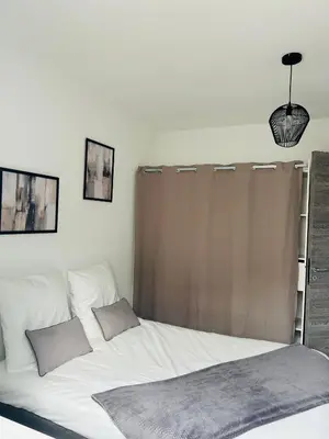Un ou plusieurs lits dans un hébergement de l'établissement Appartement T2 Corte
