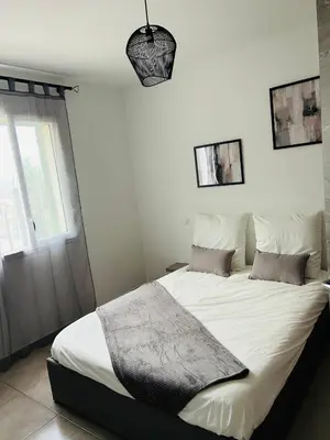 Un ou plusieurs lits dans un hébergement de l'établissement Appartement T2 Corte