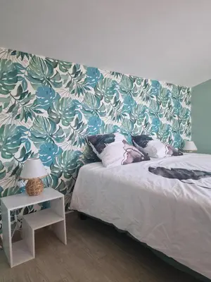 Un ou plusieurs lits dans un hébergement de l'établissement Maison pour 4 personnes en bord de mer